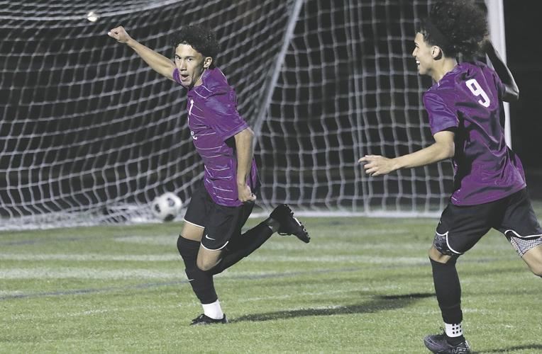  Two beloit memorial high school boys soccer players guarding the net